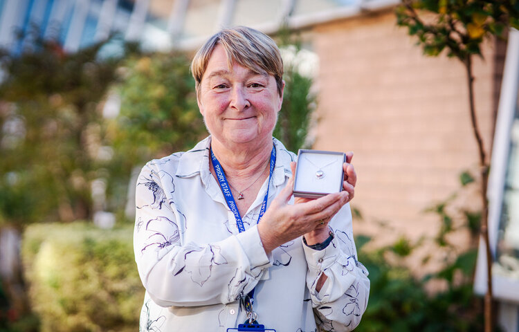 Image of Mrs Simpson's Long Service Award Takes Her Back To Former Pupil